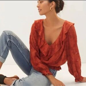 Anthropologie red blouse with floral texture. Never been worn